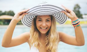 Lady with a hat smiling