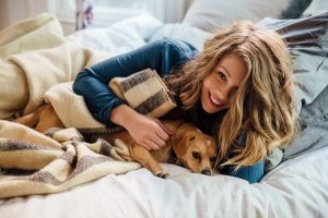 Lady cuddling with her dog